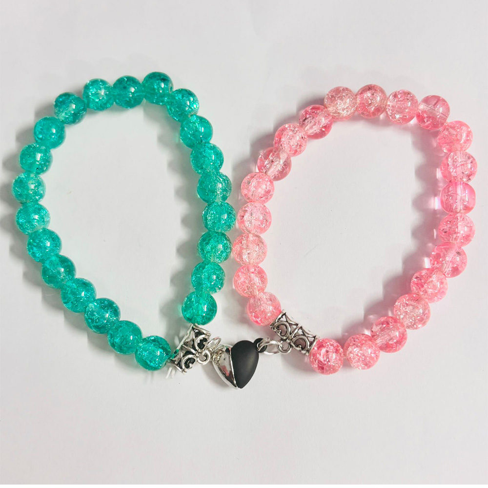 Magnetic Heart Couple Bracelets with teal and pink crackled glass beads, connected by a magnetic heart charm.