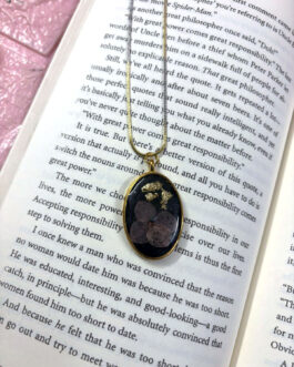 Oval Black Resin Pendant with Floral Accent