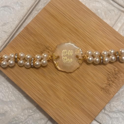 elegant “BFF Bro” resin rakhi with pearl beads and gold accents for Raksha Bandhan